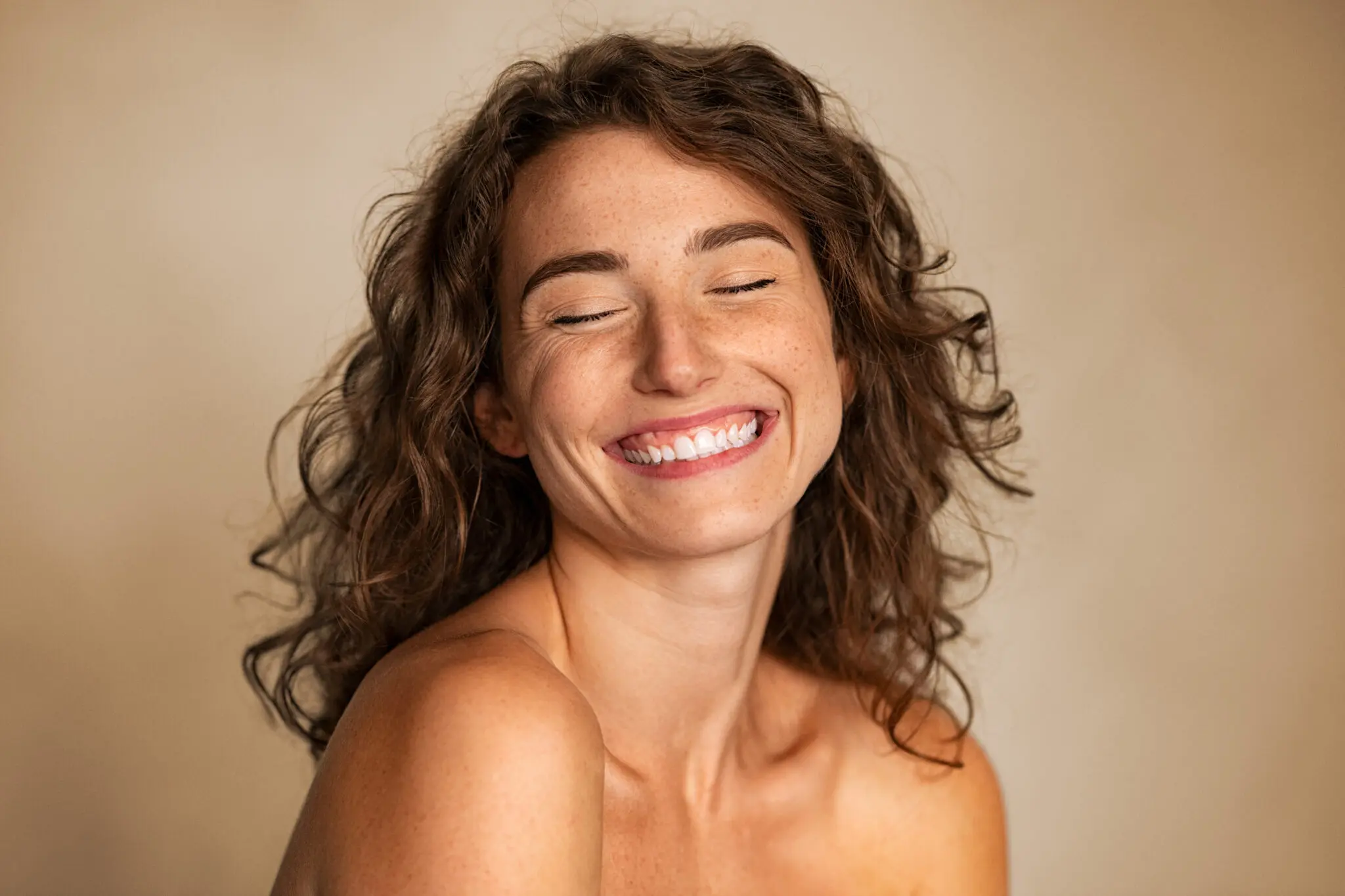 Close,Up,Of,Carefree,Young,Woman,Laughing.,Portrait,Of,Smiling