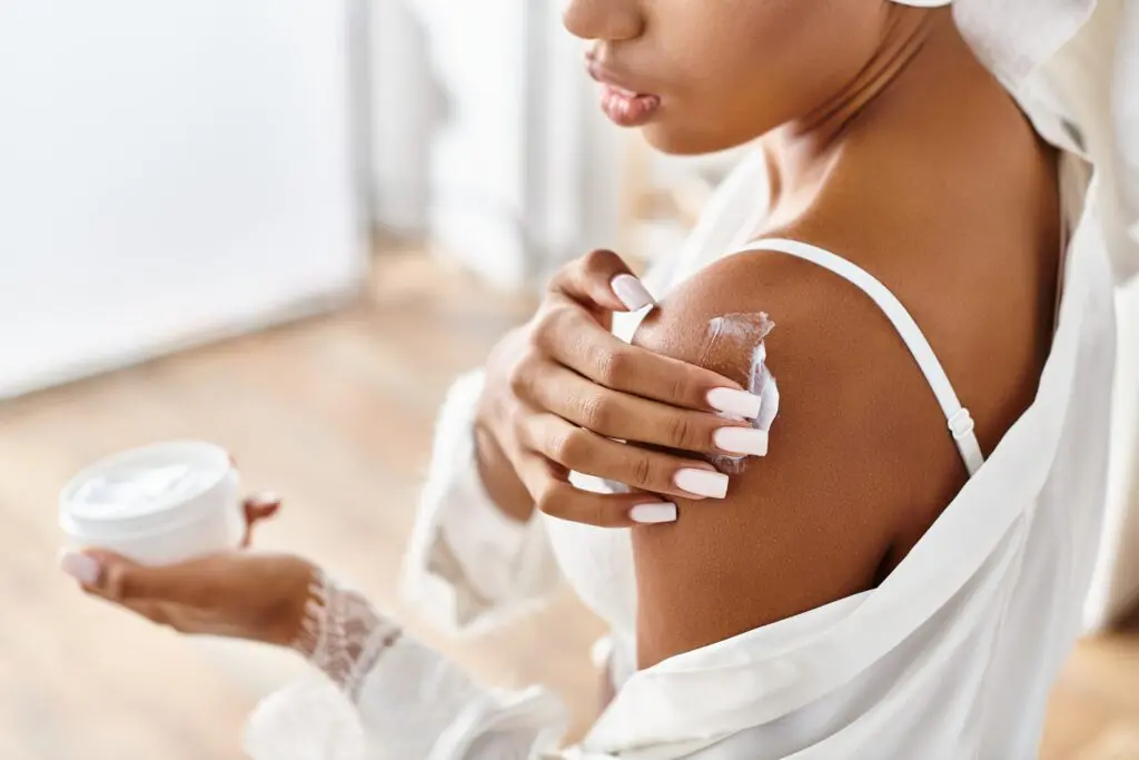 African,American,Woman,In,White,Dress,Holding,A,Jar,Of