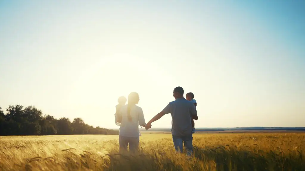 Happy,Family,In,Park,Wheat,Field.,Friendly,Family,Walks,In