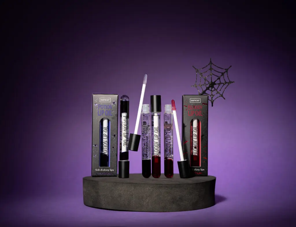 Sence Halloween Lip Oil duo with spooky decorations