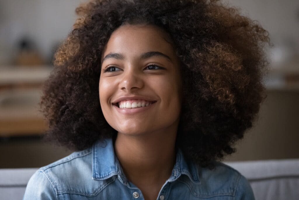 Close,Up,Beautiful,African,Teenager,Girl,Sitting,On,Sofa,At Close,Up,Beautiful,African,Teenager,Girl,Sitting,On,Sofa,At